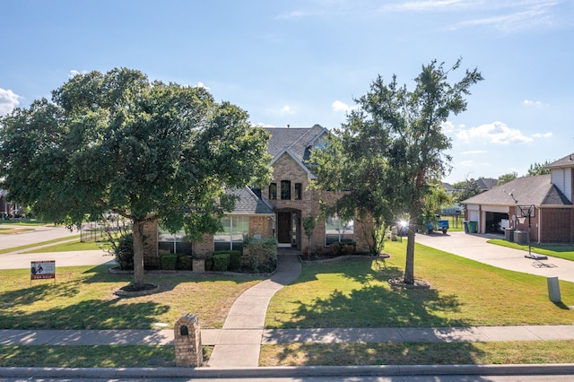 view of front of house with a garage and a front yard