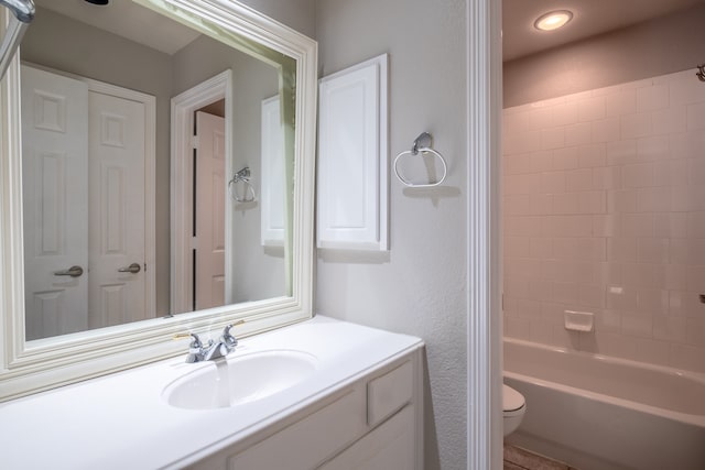 full bathroom with vanity,  shower combination, and toilet