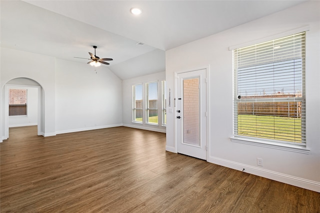 unfurnished living room with hardwood / wood-style floors, ceiling fan, and vaulted ceiling