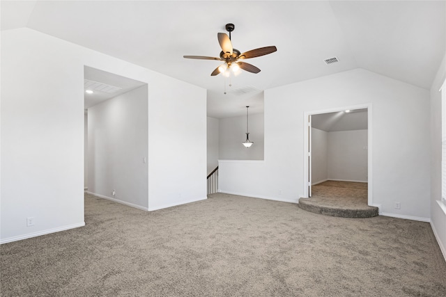 unfurnished living room featuring carpet, ceiling fan, and vaulted ceiling