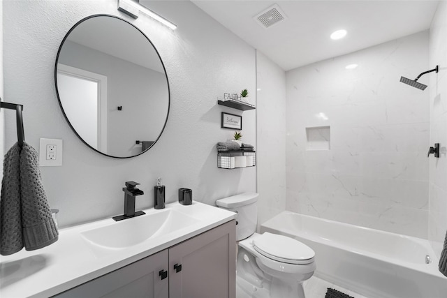 bathroom with bathtub / shower combination, visible vents, vanity, and toilet