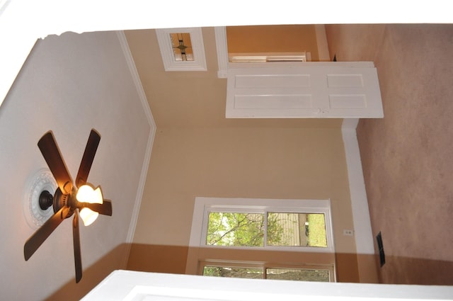 interior space featuring ceiling fan