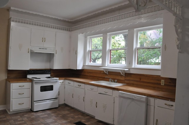 kitchen with wood counters, white appliances, white cabinets, and sink