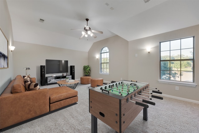 playroom featuring lofted ceiling, carpet floors, and ceiling fan