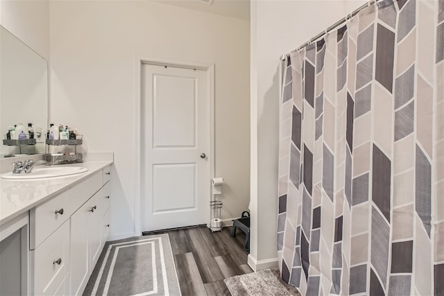 bathroom featuring vanity and hardwood / wood-style floors