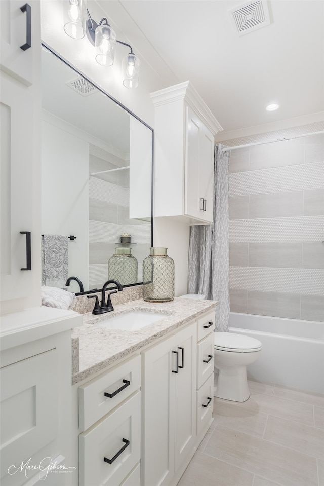 full bathroom featuring shower / tub combo with curtain, vanity, tile patterned flooring, and toilet