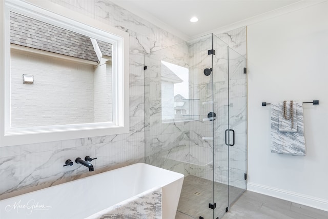 bathroom featuring shower with separate bathtub, tile walls, and ornamental molding