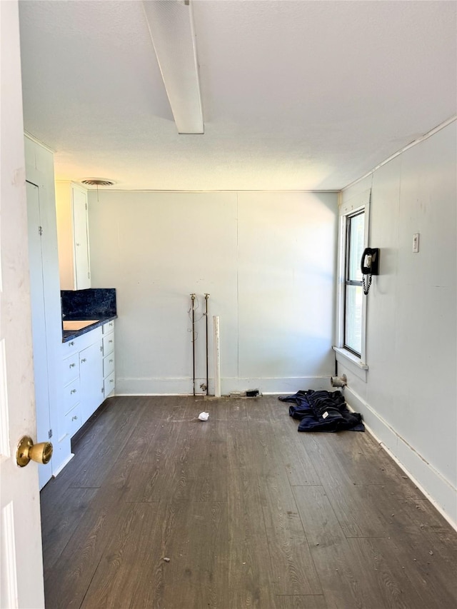 interior space with dark hardwood / wood-style flooring