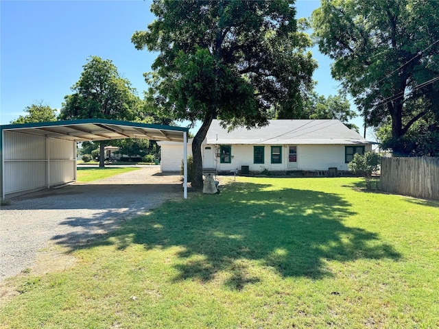 single story home featuring a front lawn and a carport