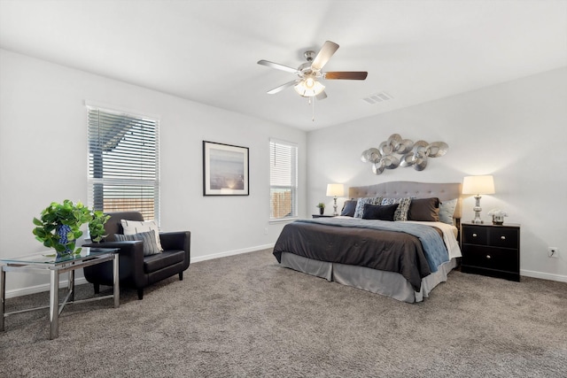 bedroom featuring ceiling fan and carpet