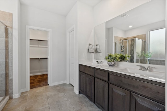 bathroom with vanity, tile patterned floors, and an enclosed shower