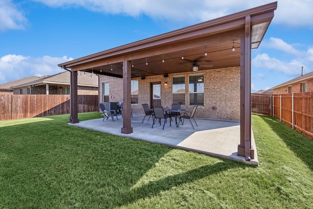 exterior space with a lawn, ceiling fan, and a patio