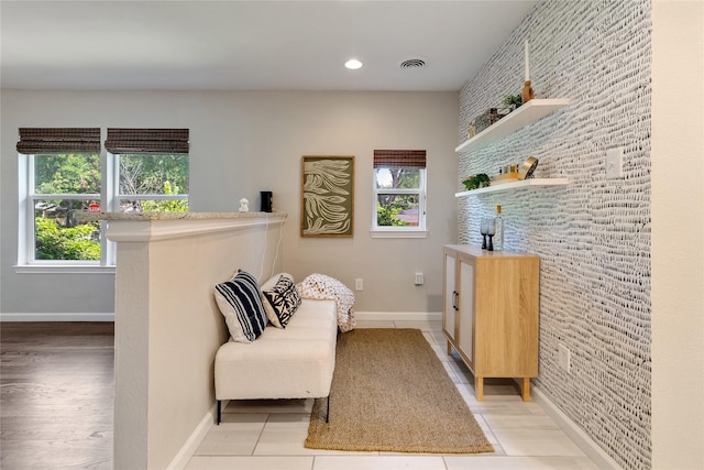 living area featuring light tile patterned floors