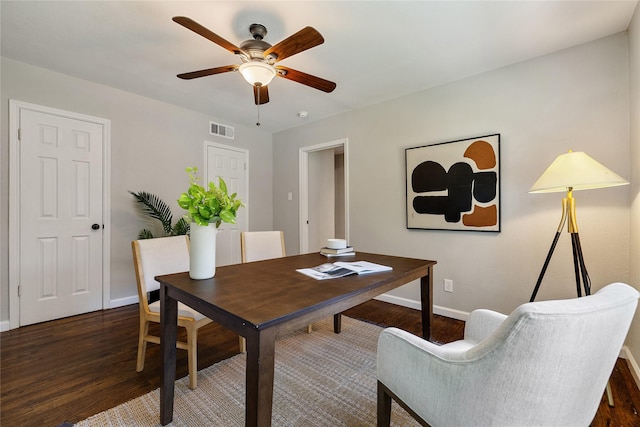 dining room featuring ceiling fan and dark hardwood / wood-style floors