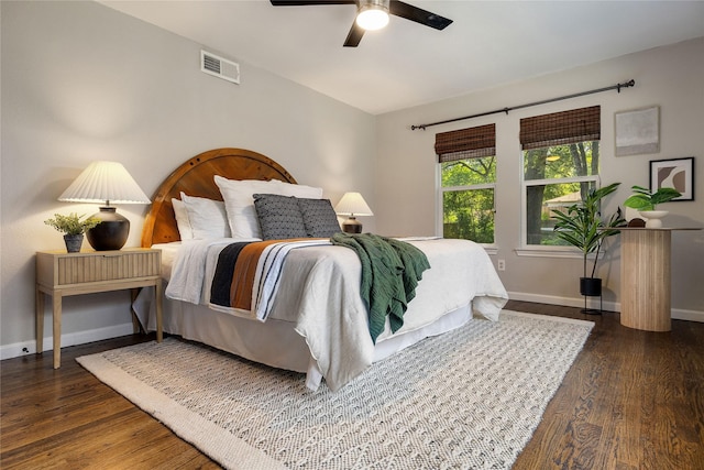 bedroom featuring ceiling fan and dark hardwood / wood-style flooring