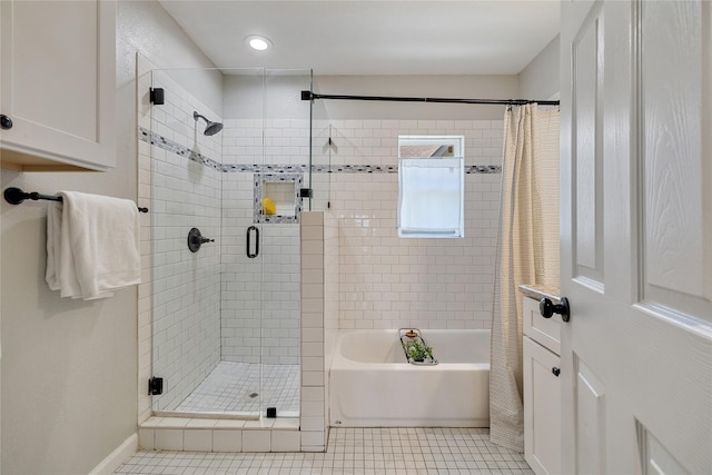 bathroom with independent shower and bath and tile patterned flooring