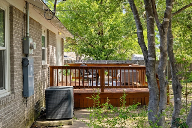 wooden terrace featuring central AC unit