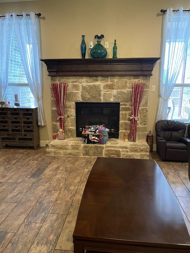 living room with a stone fireplace