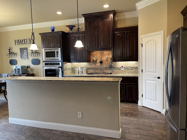 kitchen with decorative light fixtures, dark brown cabinets, backsplash, and stainless steel appliances