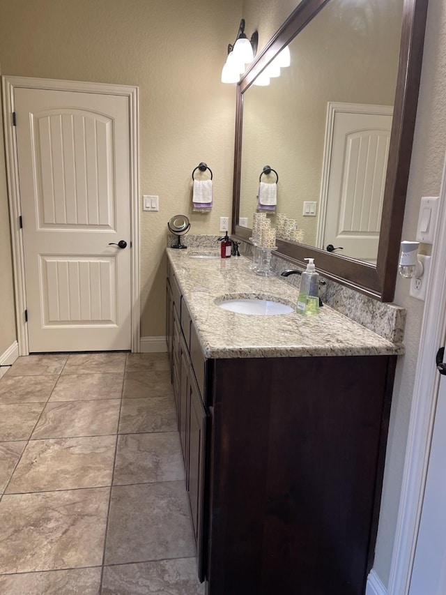 bathroom with vanity and tile patterned flooring