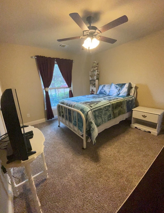 bedroom with ceiling fan and carpet floors