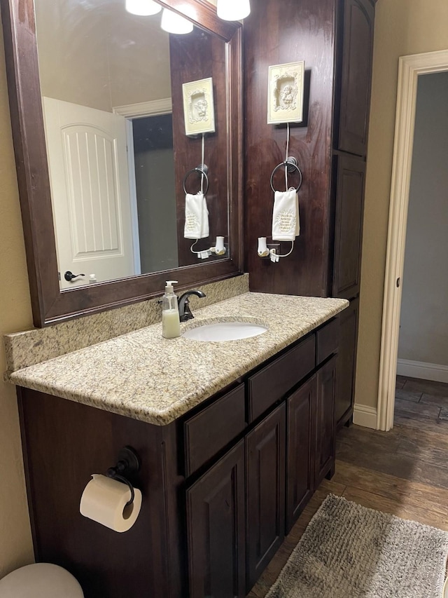 bathroom with wood-type flooring and vanity