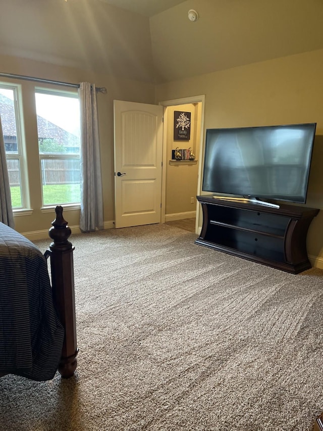 carpeted bedroom with vaulted ceiling