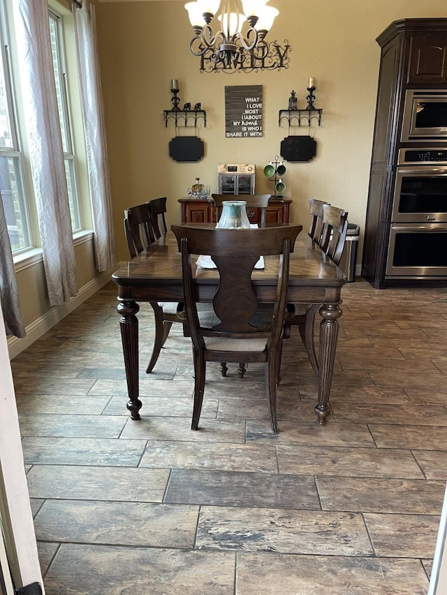 dining space featuring an inviting chandelier