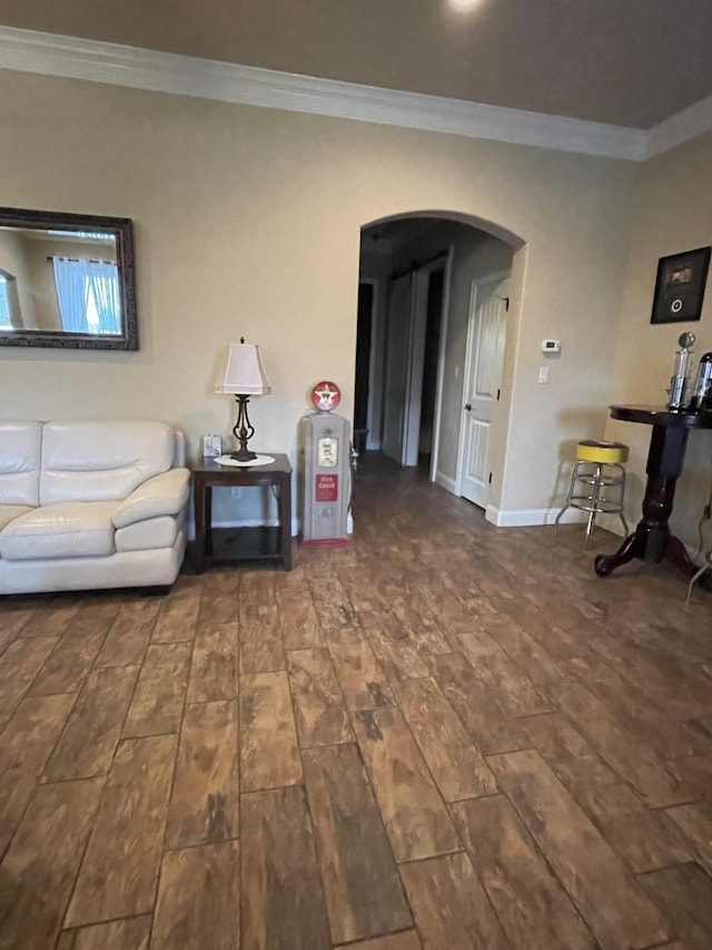 unfurnished living room with dark wood-type flooring and ornamental molding