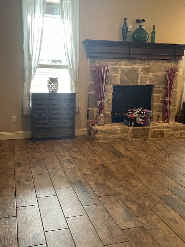 interior space with a fireplace and hardwood / wood-style flooring