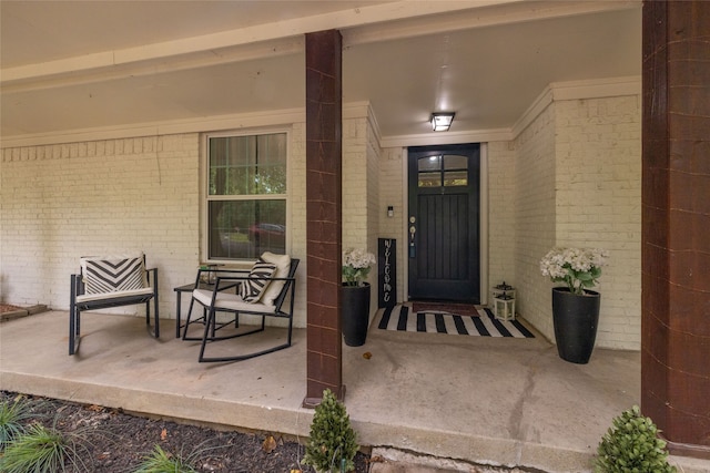 property entrance with elevator and covered porch