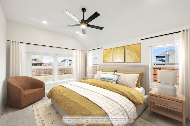 carpeted bedroom featuring ceiling fan, lofted ceiling, and multiple windows