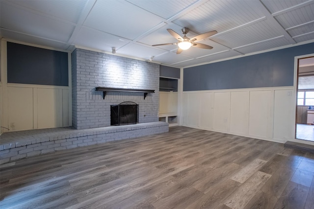 unfurnished living room featuring ceiling fan, a fireplace, and hardwood / wood-style floors