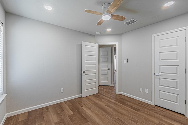 unfurnished bedroom featuring ceiling fan and light wood-type flooring