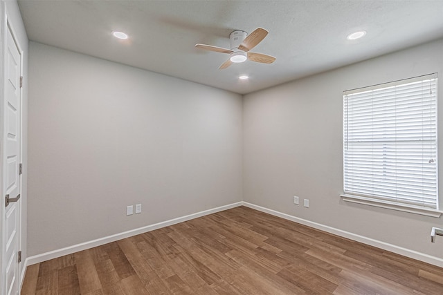 spare room featuring ceiling fan and hardwood / wood-style floors