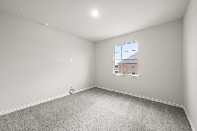 empty room with carpet flooring