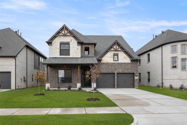 view of front facade with a garage and a front lawn