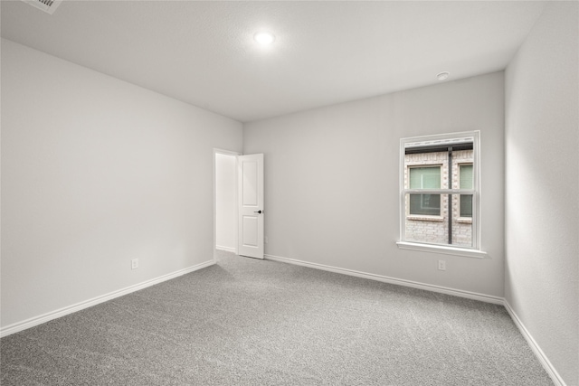 empty room with carpet flooring