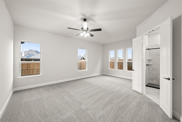 unfurnished bedroom featuring light colored carpet and ceiling fan