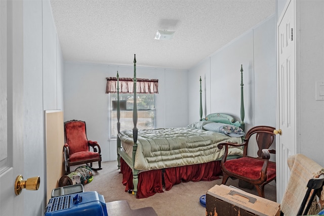 carpeted bedroom with a textured ceiling