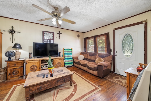 living room featuring a textured ceiling, ceiling fan, and wood-type flooring