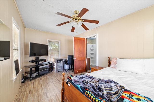 bedroom featuring a textured ceiling and ceiling fan