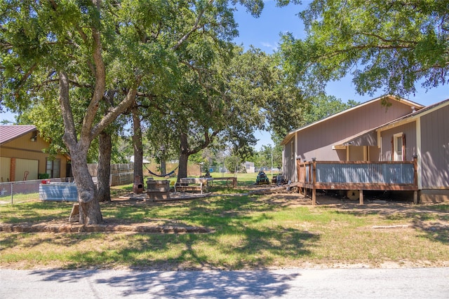 view of yard with a wooden deck