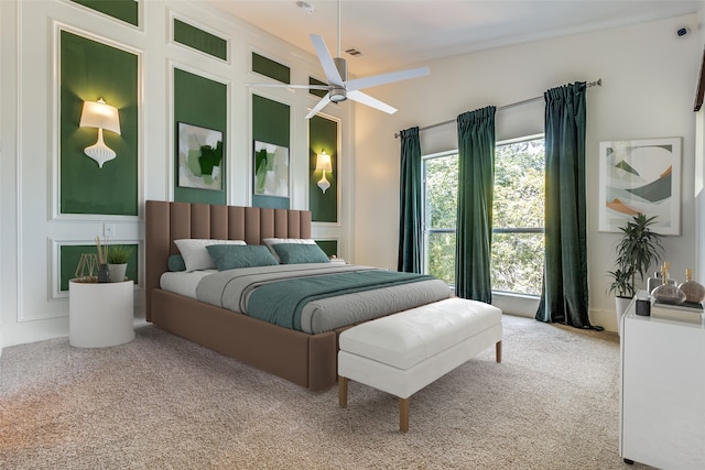 bedroom featuring ceiling fan and carpet floors