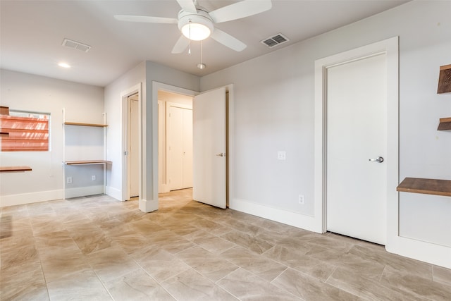 interior space with ceiling fan