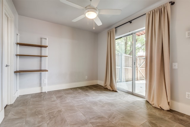 spare room with ceiling fan