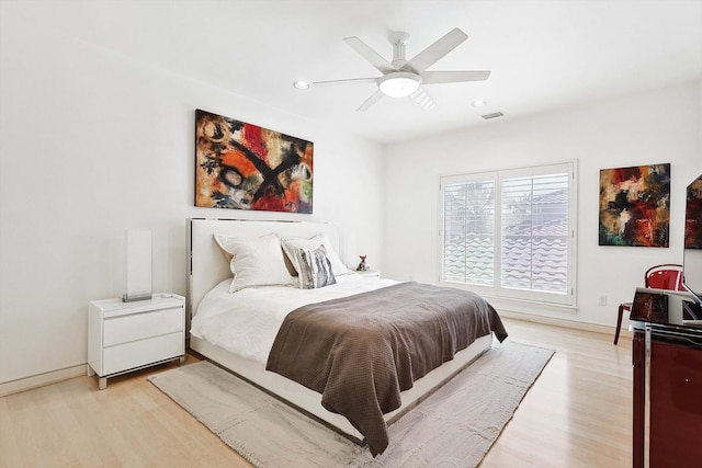 bedroom featuring light hardwood / wood-style floors and ceiling fan