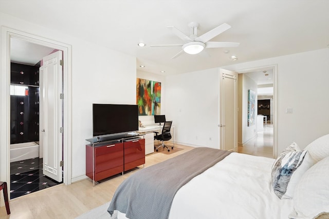 bedroom with light wood-type flooring and ceiling fan