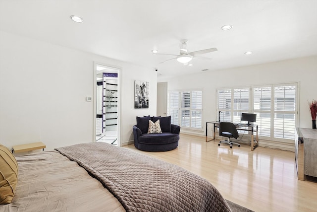 bedroom with light hardwood / wood-style floors and ceiling fan