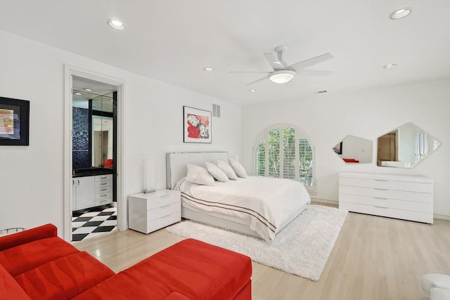 bedroom with ceiling fan and light wood-type flooring